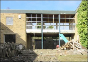 Removal of the fascia panels marks the start of demolition of the Science link bridge.