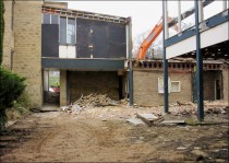 The second lion's head can be seen on the rear wall of an alcove close to the Clegg building.