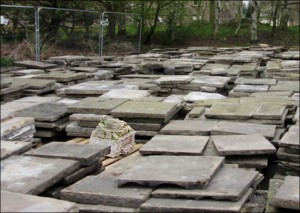 The lion's head from the alcove was removed at an early stage of the general demolition programme, and sits alone, temporarily stored with paving stones.